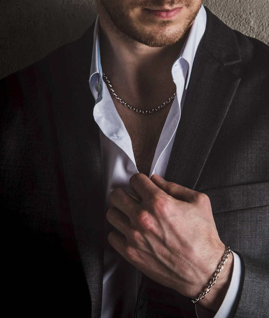 A 4mm men's platinum rolo link chain necklace and a rolo link chain bracelet wearing on a male model in formal suit