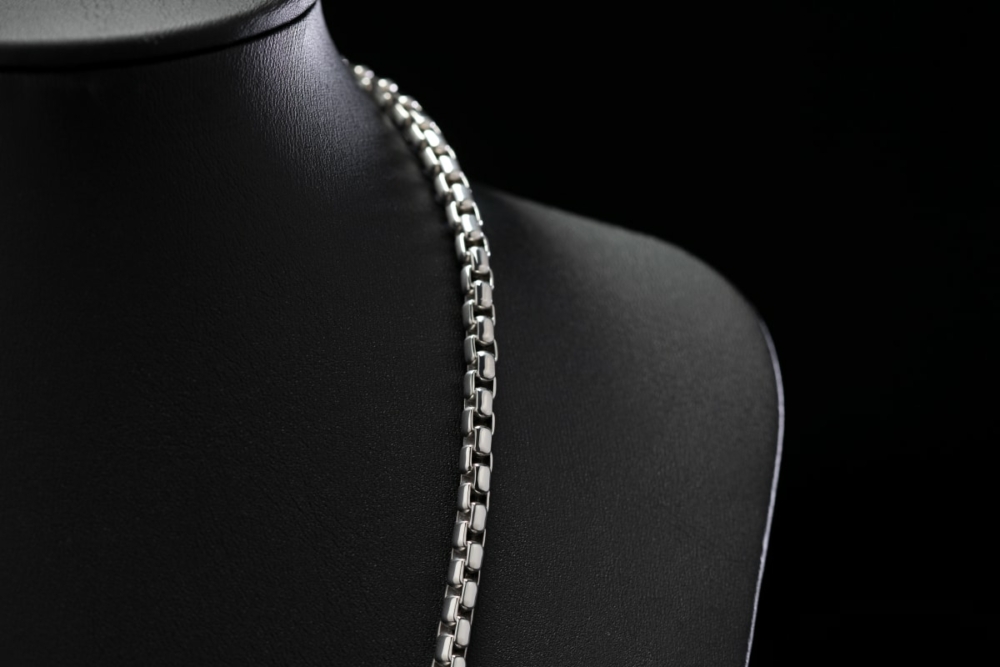 A 4.3mm men's platinum box chain necklace with a durable clasp