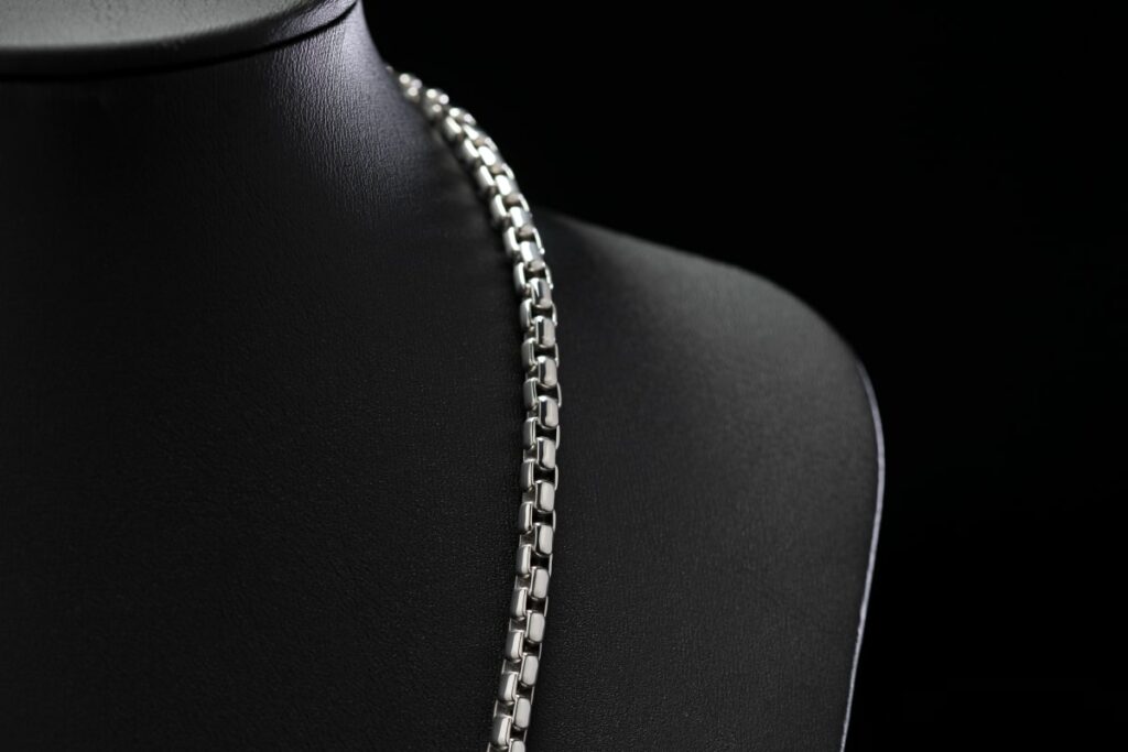 A 4.3mm men's platinum box chain necklace with a durable clasp
