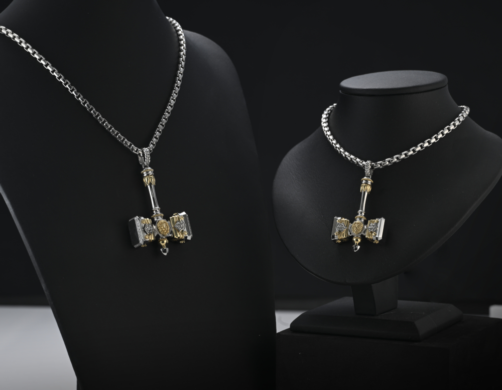 The hammer pendant in PT950 and 18K yellow gold, a standard size of the hammer pendant and with a 20% larger bespoke hammer pendant, pairing with a box chain from ByEnzo Jewelry.